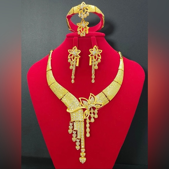 Mia Wynn Gold Jewelry Set, Including Necklace, Earrings, Bracelet And Ring.